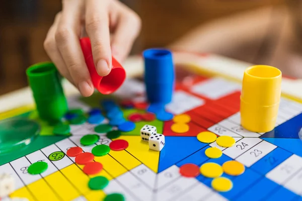 Entradas para la Warner, Bioparc o noche de hotel, entre los premios del torneo de parchís del Calvario - depositphotos 372015742 stock photo woman hand throwing two dices Torneo de parchís